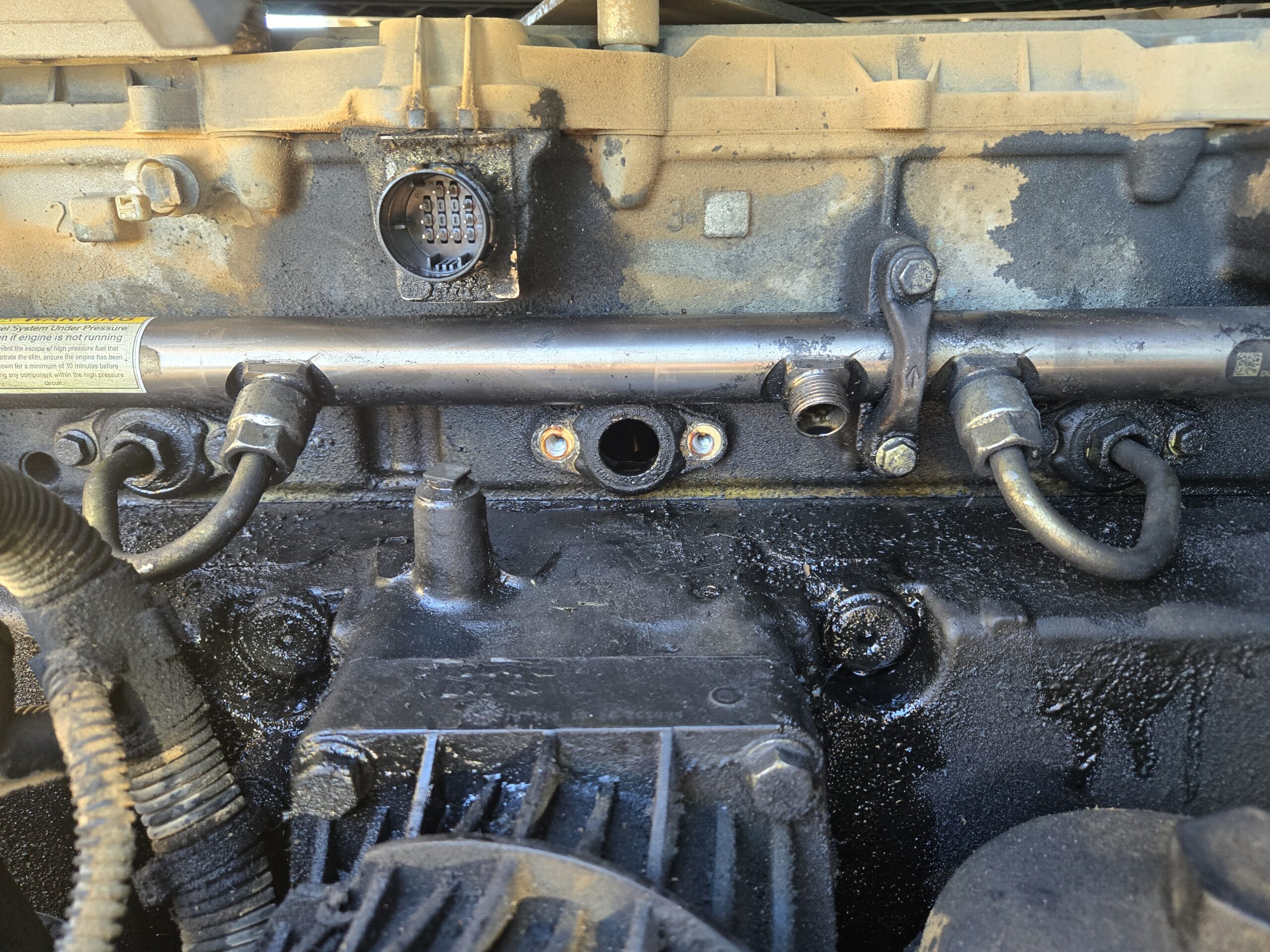 Close-up of engine components in a heavy duty truck at Big Wheels Repair in Gainesville, highlighting the need for repair and maintenance services.