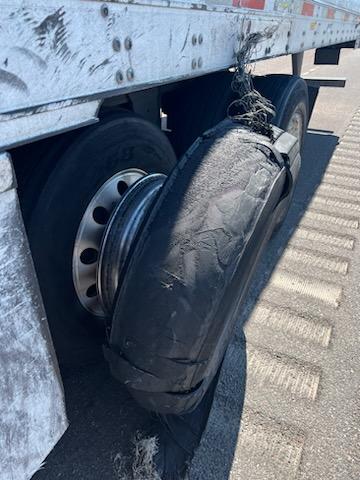 Damaged tire on a commercial trailer, highlighting the need for big truck tire services at Big Wheels Repair in Gainesville.