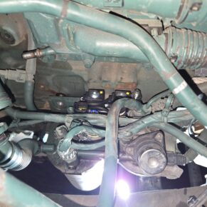 Close-up of engine components and wiring in a heavy duty truck at Big Wheels Repair in Gainesville, showcasing our maintenance and repair services.