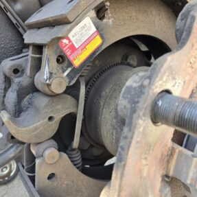 Close-up view of a brake component at Big Wheels Repair in Gainesville, highlighting our expertise in heavy duty truck repair and semi-truck maintenance.