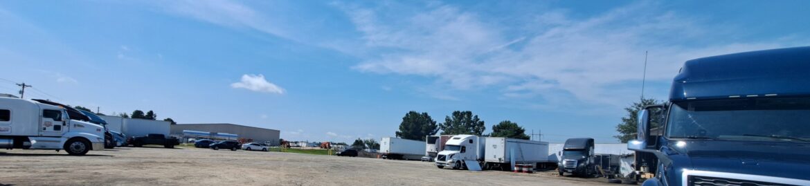 Trucks parked at Big Wheels Repair in Gainesville, showcasing the heavy duty truck repair shop and semi-truck maintenance services.