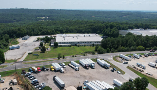 Aerial view of Big Wheels Repair in Gainesville, showing the heavy duty truck repair shop's facility and parking area with multiple trucks and trailers.