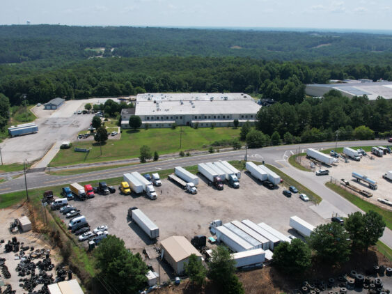 Aerial view of Big Wheels Repair in Gainesville, showing the heavy duty truck repair shop's facility and parking area with multiple trucks and trailers.