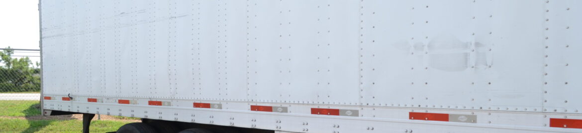 Side view of a commercial trailer at Big Wheels Repair in Gainesville, illustrating repair and maintenance services