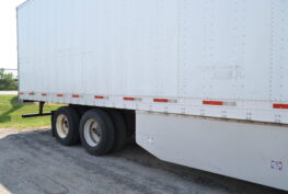 Side view of a commercial trailer at Big Wheels Repair in Gainesville, illustrating repair and maintenance services