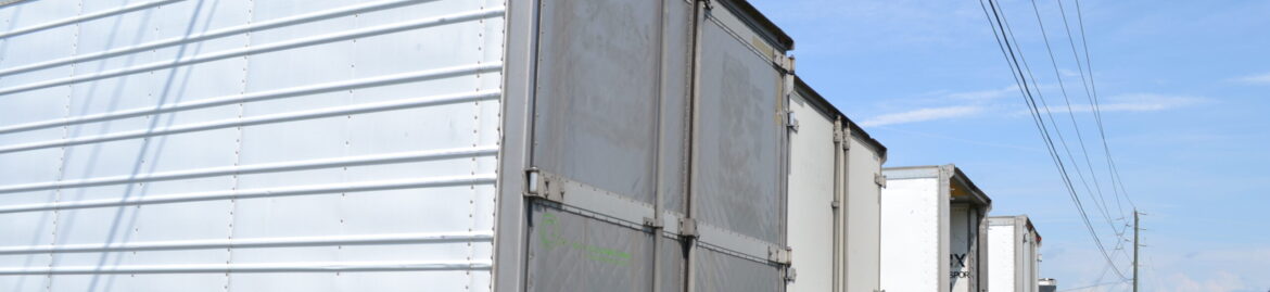 Line of commercial trailers at Big Wheels Repair in Gainesville, highlighting our commercial trailer repair services.