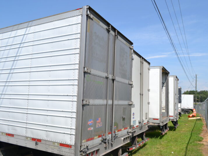 Line of commercial trailers at Big Wheels Repair in Gainesville, highlighting our commercial trailer repair services.