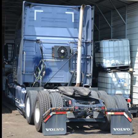 A semi-truck undergoing maintenance at Big Wheels Repair in Gainesville, highlighting heavy duty truck repair and commercial trailer repair services.